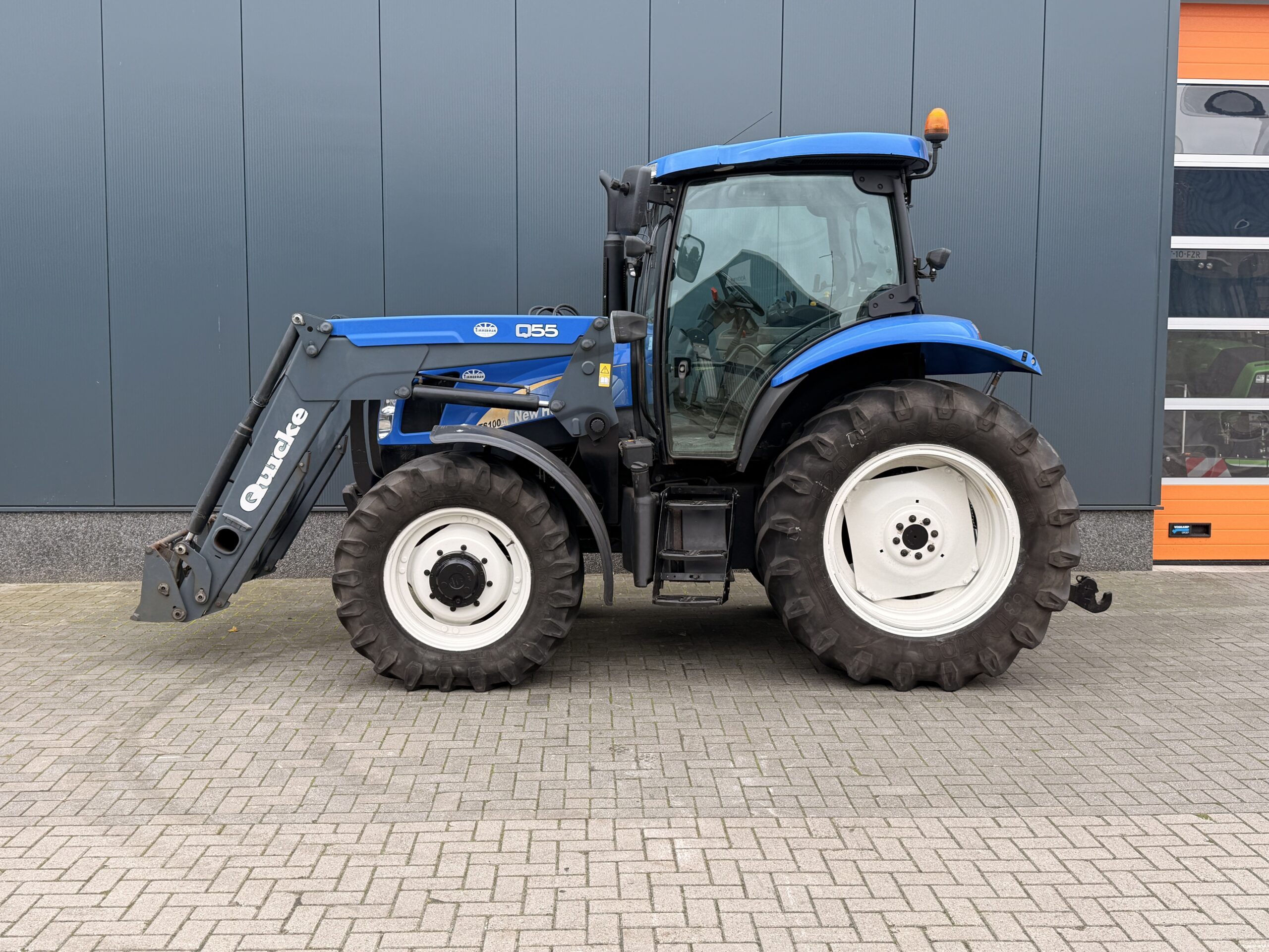 New Holland TS100 met Quicke Q55 voorlader - Afbeelding 12